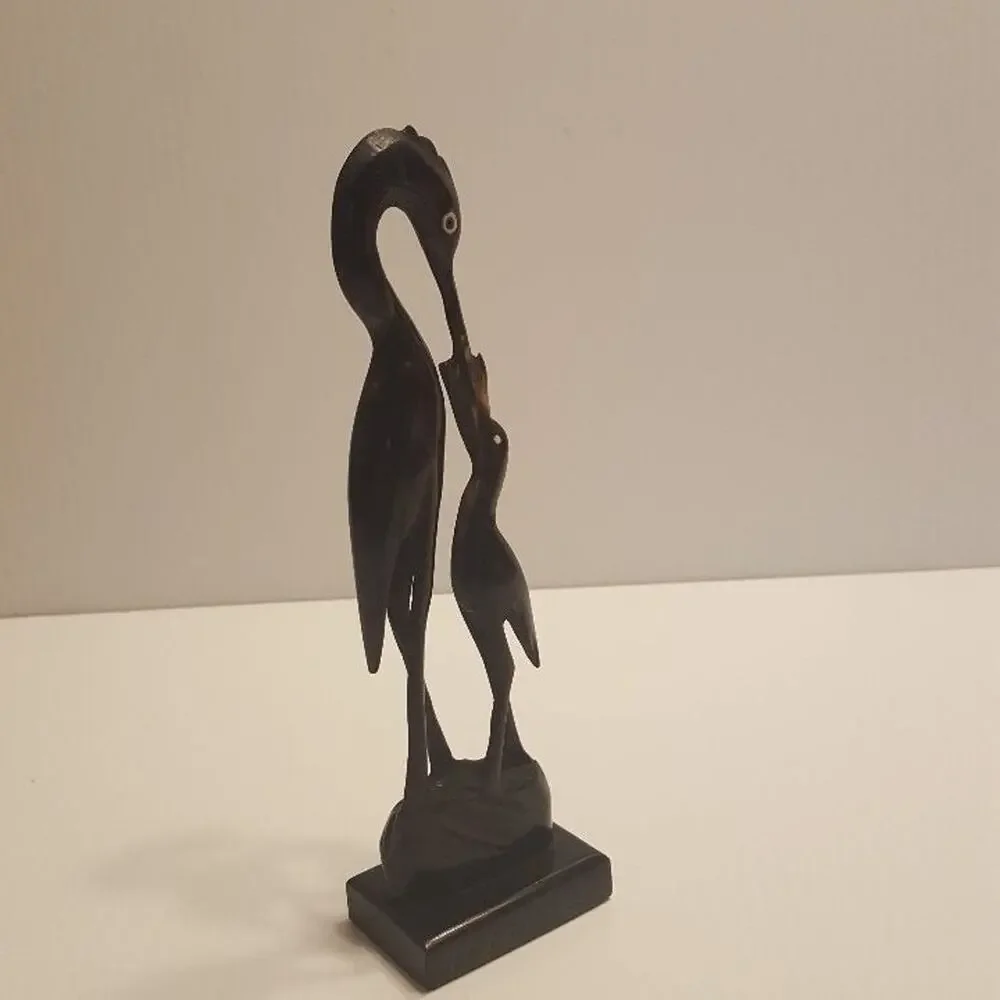 Vintage Stork Bone Figurine feeding a chick. Pre-owned, great shape.